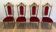 Set of 4 chairs in brass and red velvet.