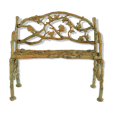 Green cast iron bench with green patina