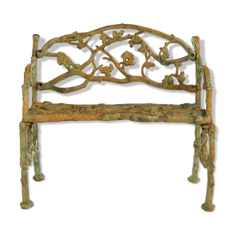 Green cast iron bench with green patina