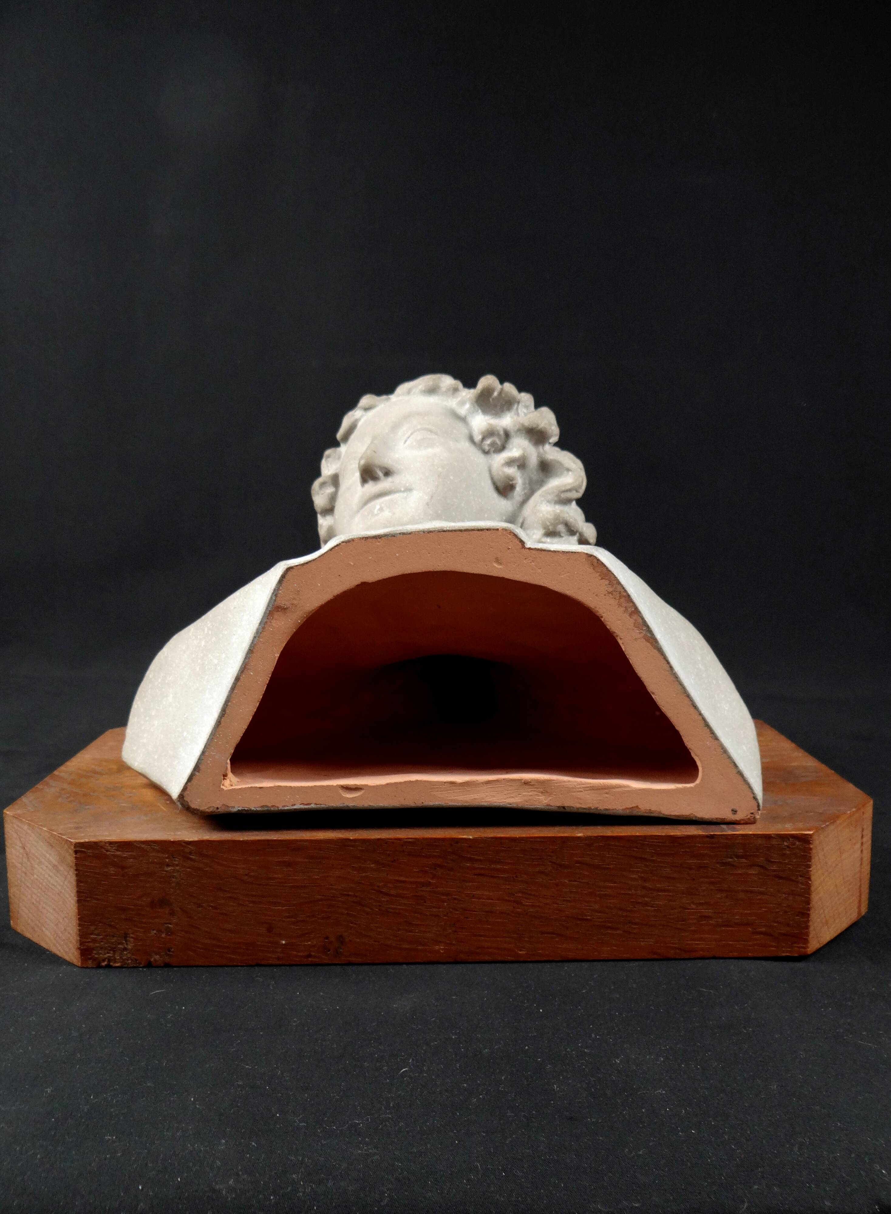 Terracotta bust of the smiling angel from Reims Cathedral with base