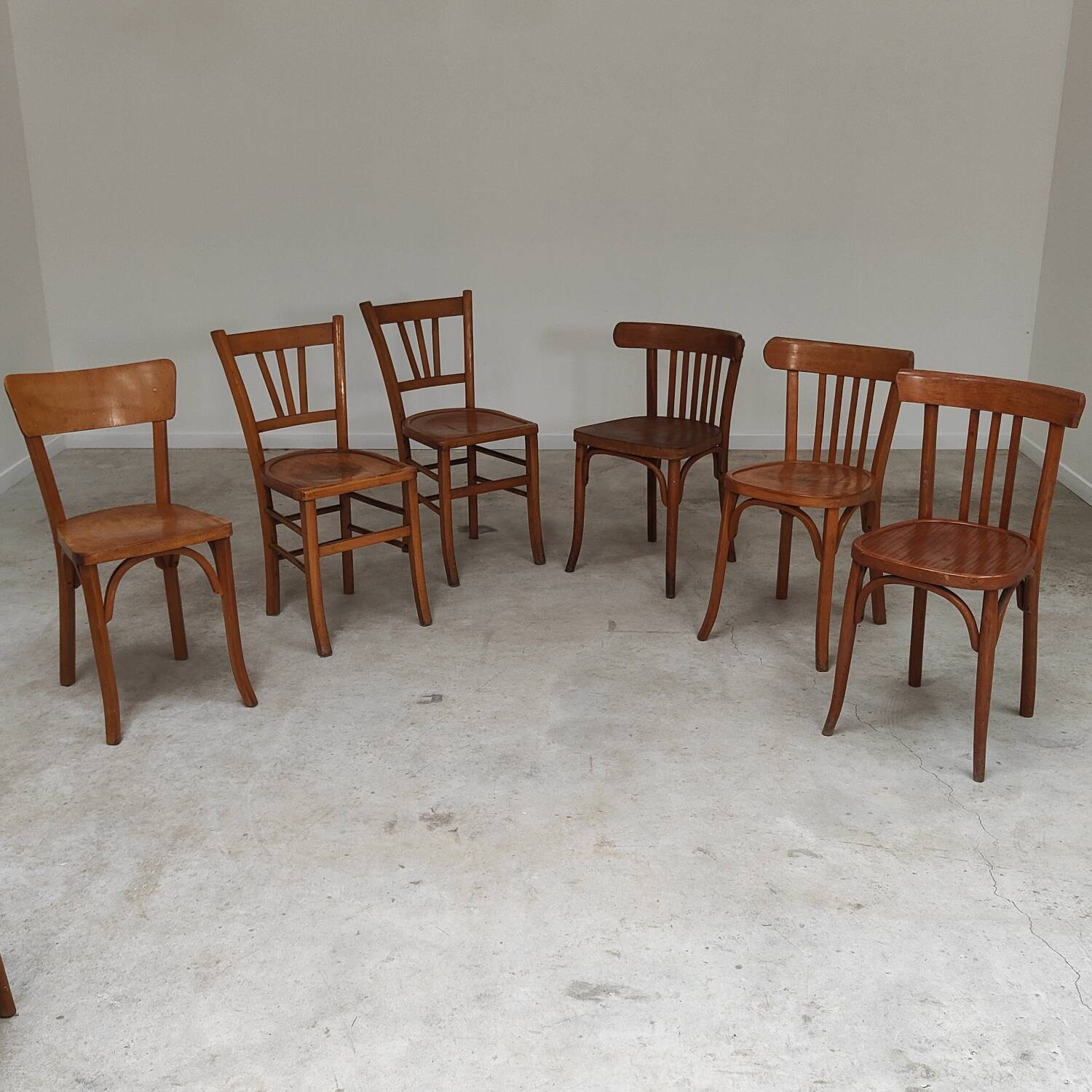 Set of 6 mismatched blond wood bistro chairs