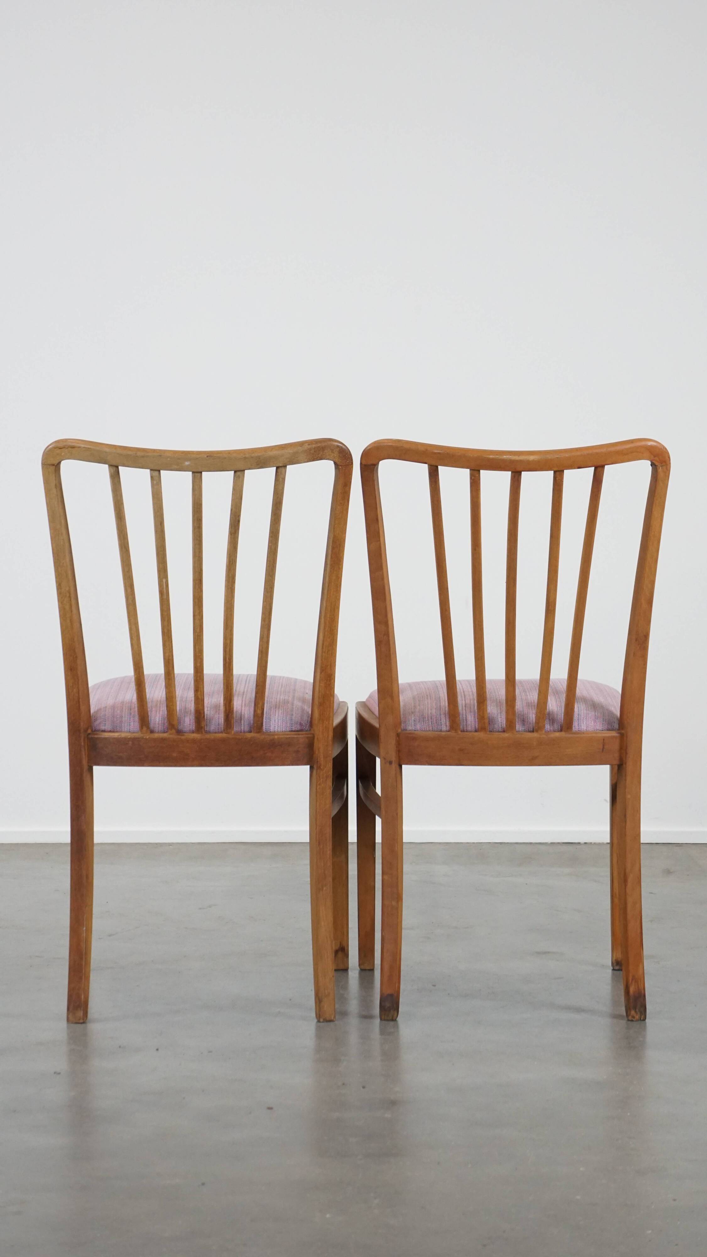 Set of 8 vintage Danish design dining chairs from the 1970s with light purple fabric seats