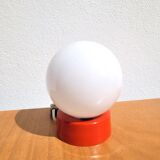 Small vintage opaline ball lamp with an orange base.
