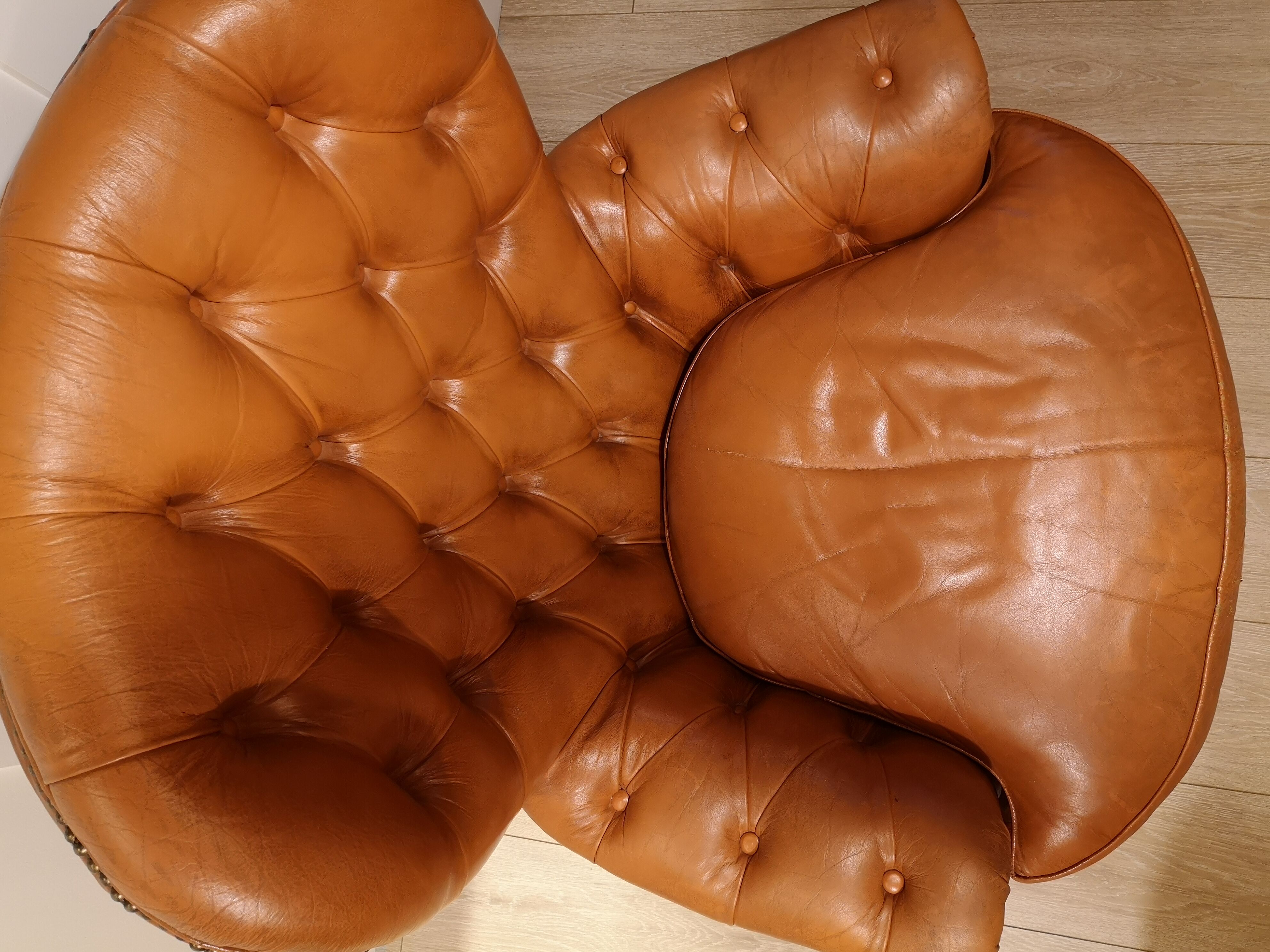 Pair of leather chesterfield chairs