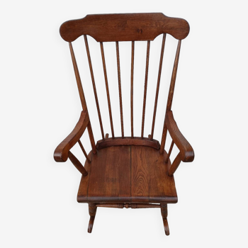 Old adult wooden rocking chair