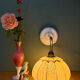 Vintage glass wall light with a pink and gold Clichy globe.