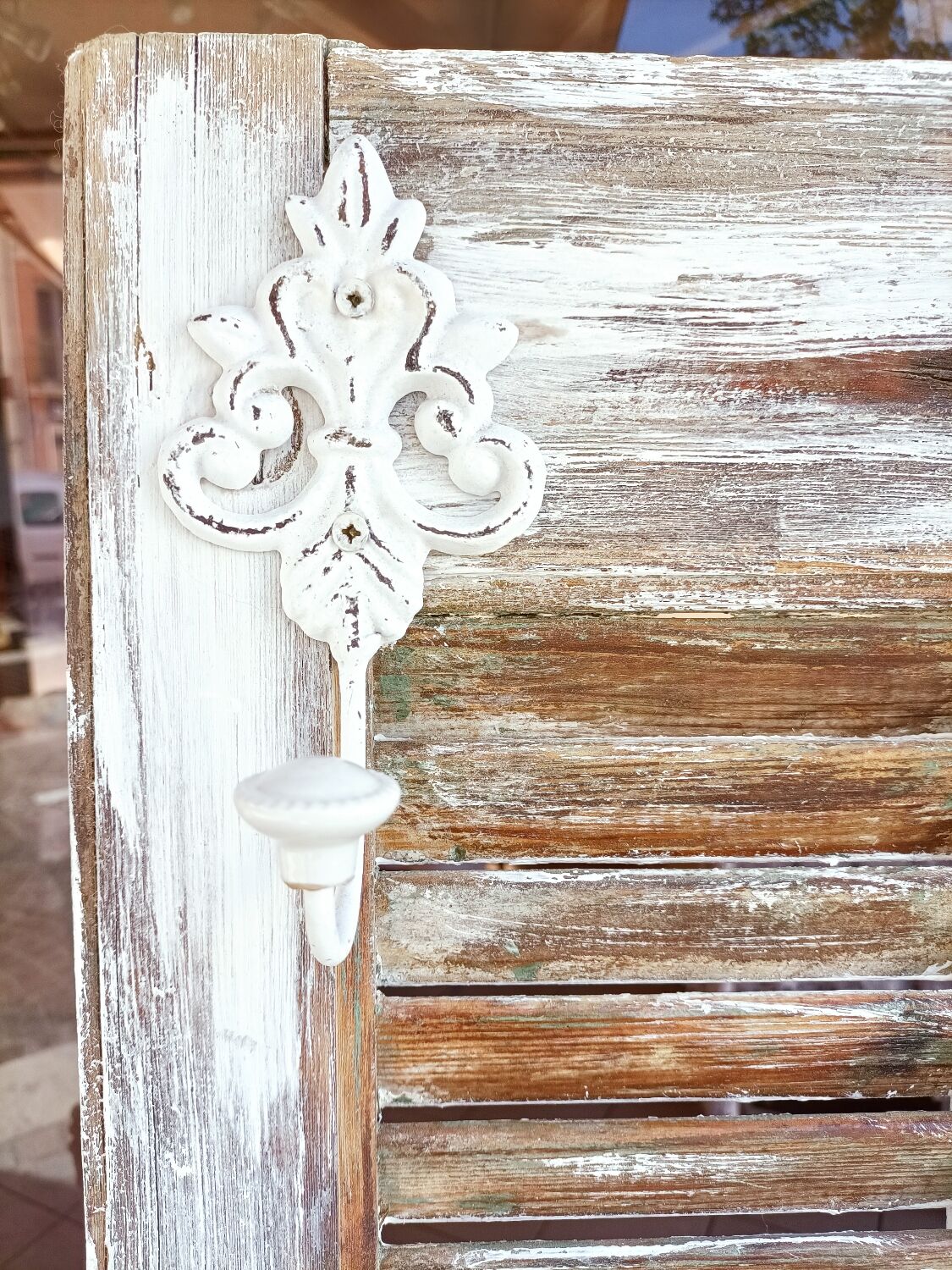 Vintage shutter renovated into a coat rack