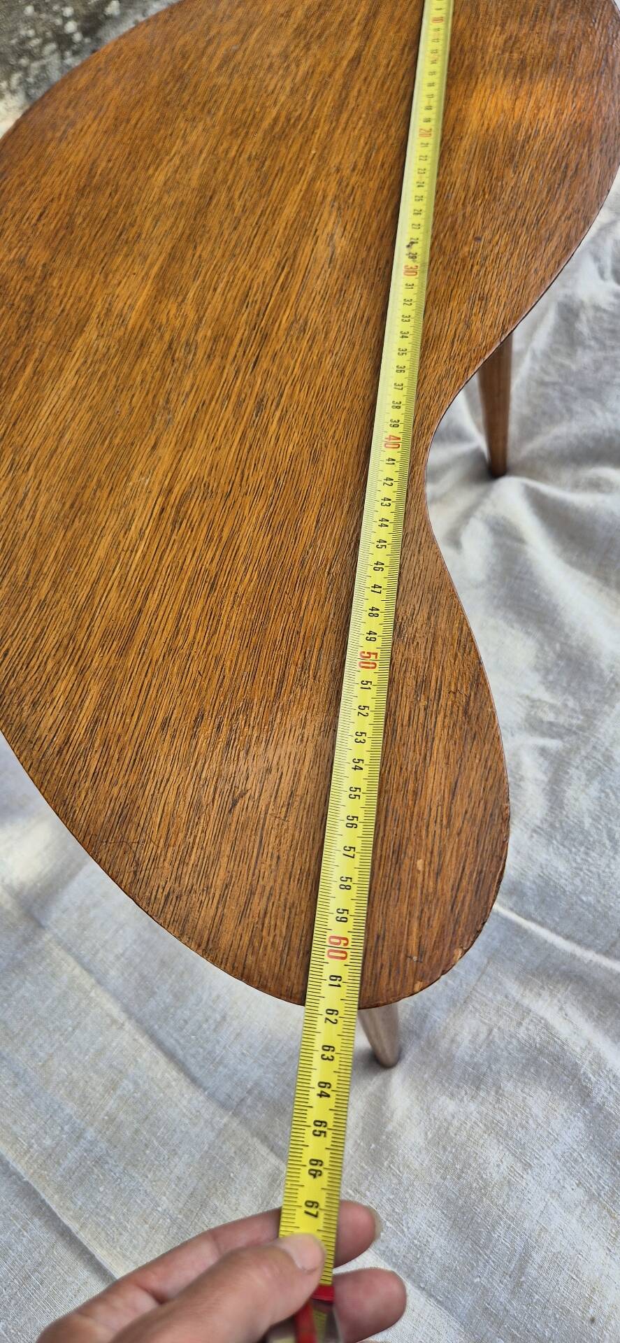 Vintage Scandinavian bean side table with wooden tapered legs.