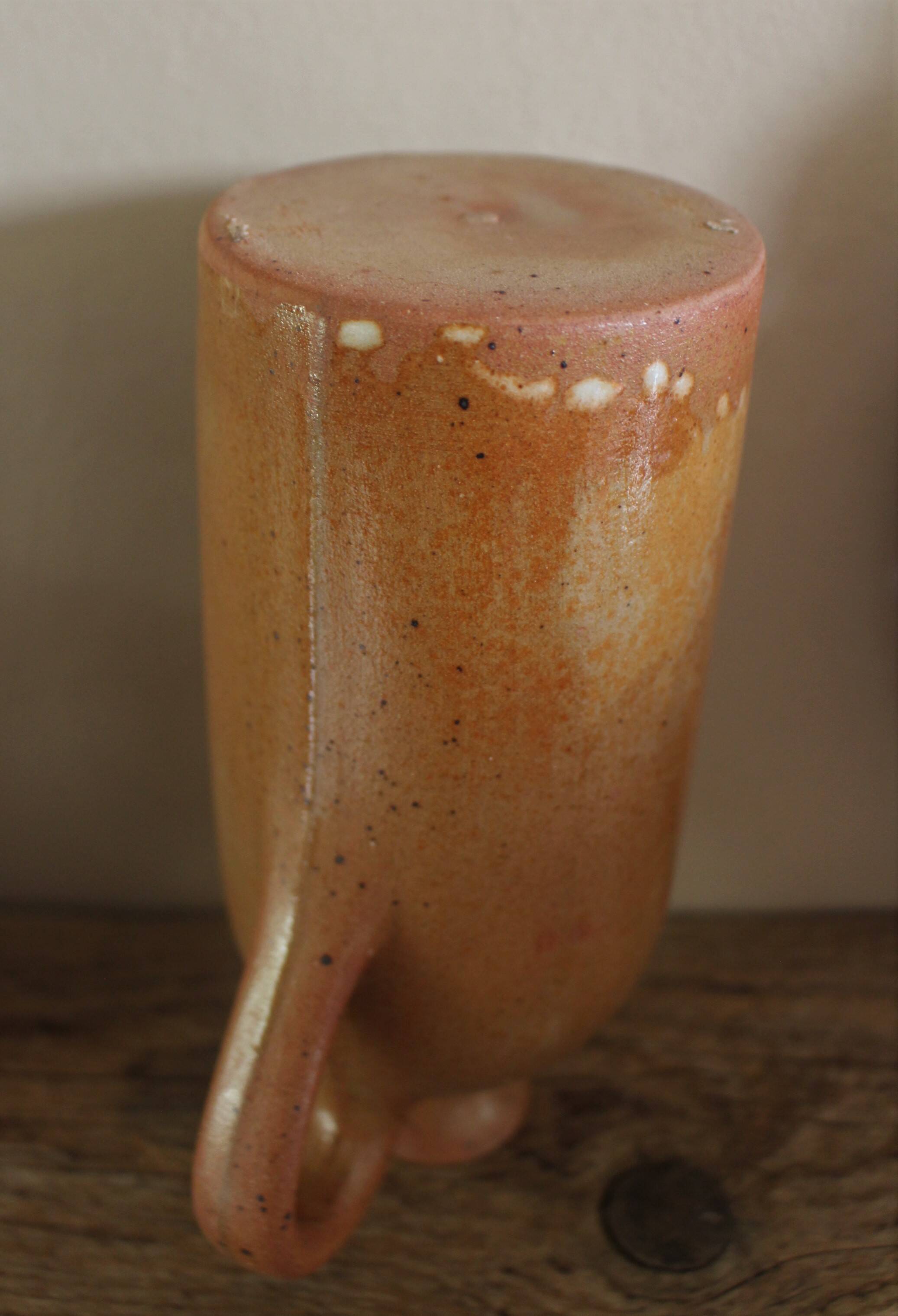 Vintage stoneware liqueur bottle with handle