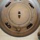 Old compact wood stove in enamelled cast iron with tripod feet with Lion's legs