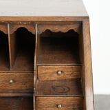 Antique English oak secretary from the 18th century with a stepped interior
