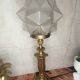 Lampe ancienne art déco en laiton avec globe étoile