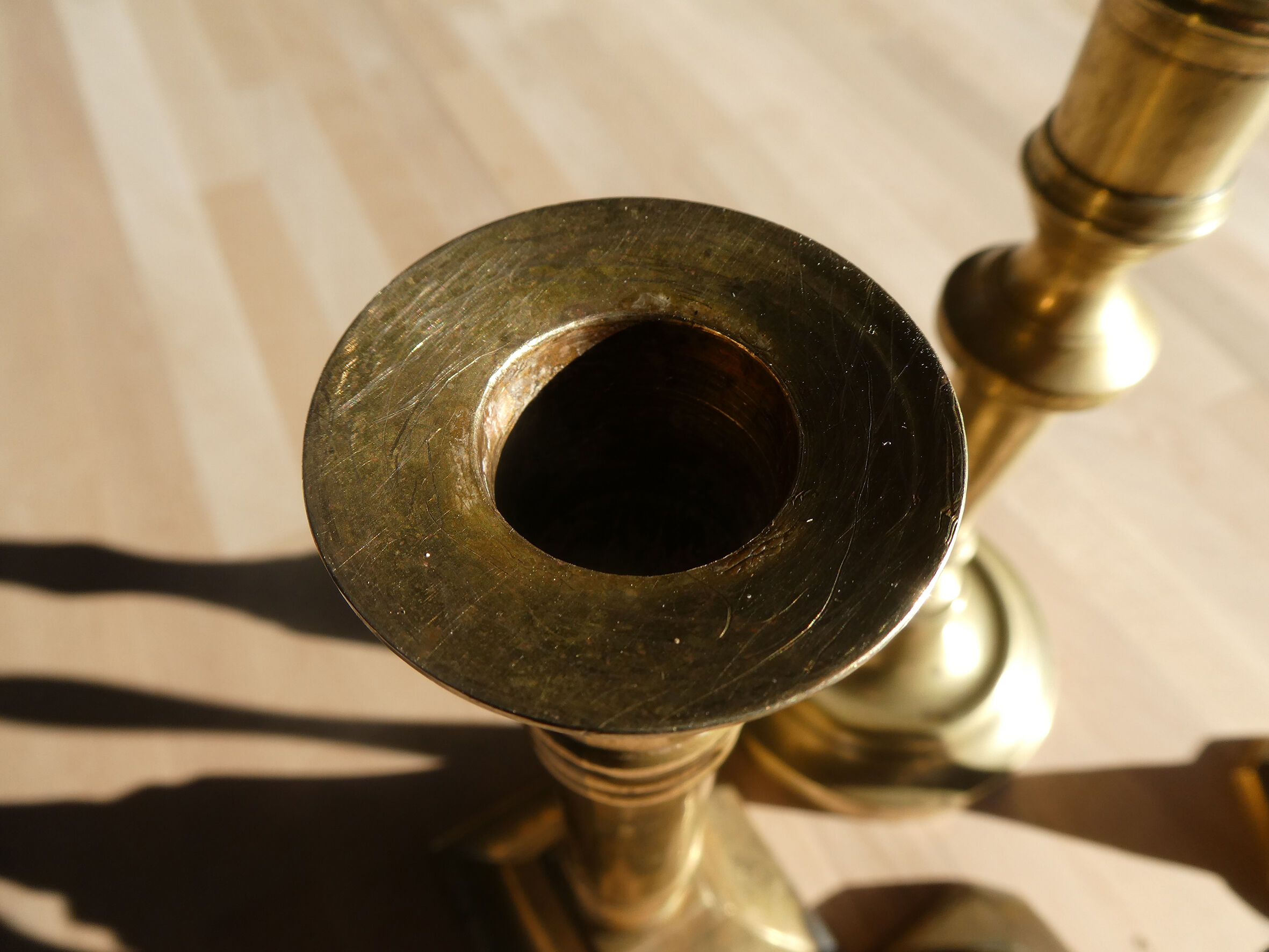 Set of 4 old candle holders in golden brass