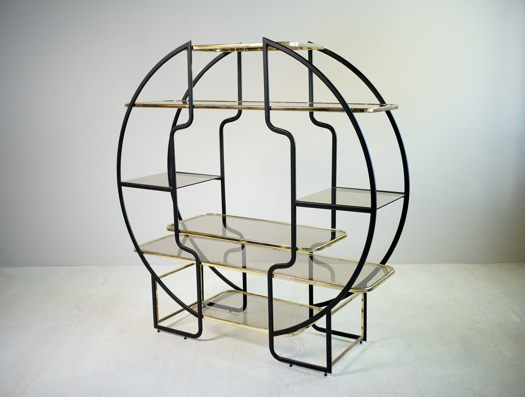 "Circle" library in black anodized metal and golden brass, 1970