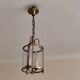 Cylindrical brass and glass lantern in Louis XVI style.
