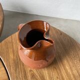Glazed earthenware jug