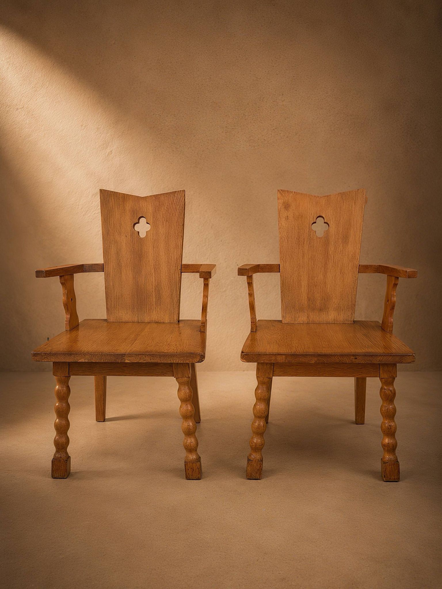 Pair of brutalist armchairs, oak, France, circa 1950.