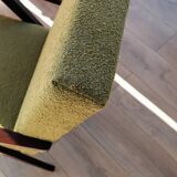 Vintage armchair in moss green bouclé design by H. Lis.