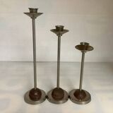 Trio of metal and wood candlesticks