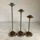 Trio of metal and wood candlesticks