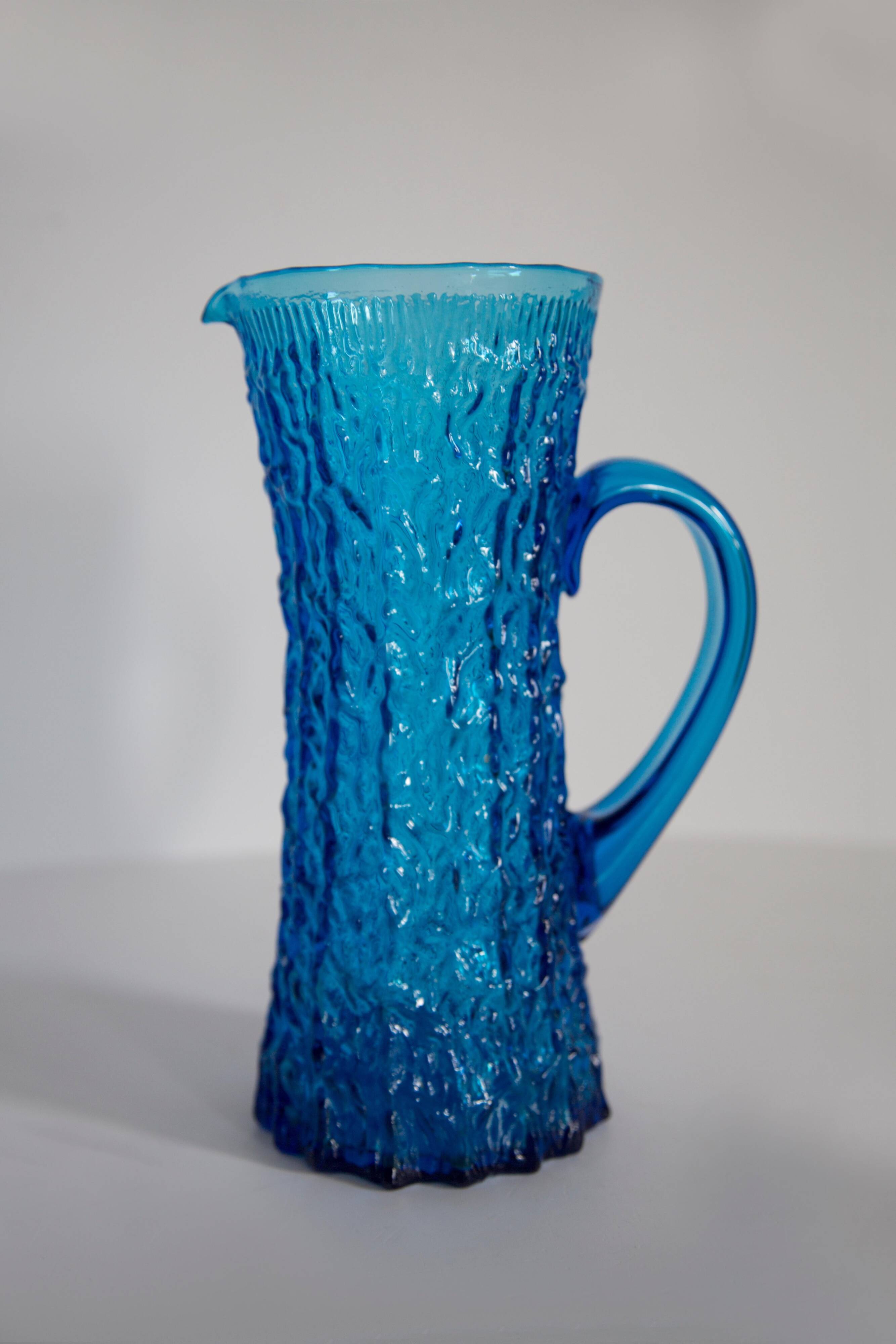 Blue glass water or juice pitcher from the mid-20th century.