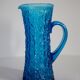 Blue glass water or juice pitcher from the mid-20th century.