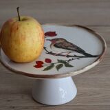 Cake display on pedestal with bird decor