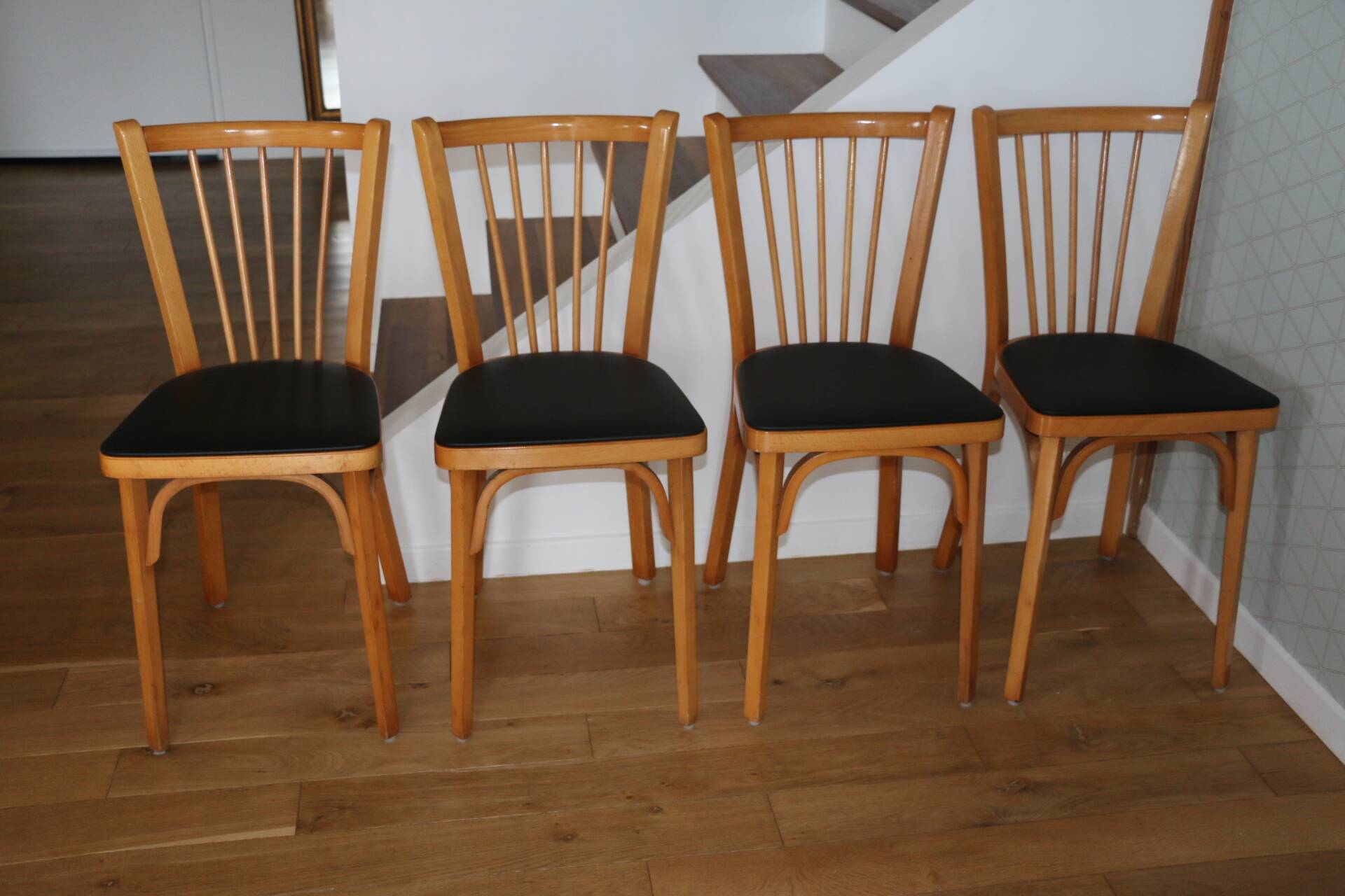4 BAUMANN N°12 chairs in black skai and light beech
