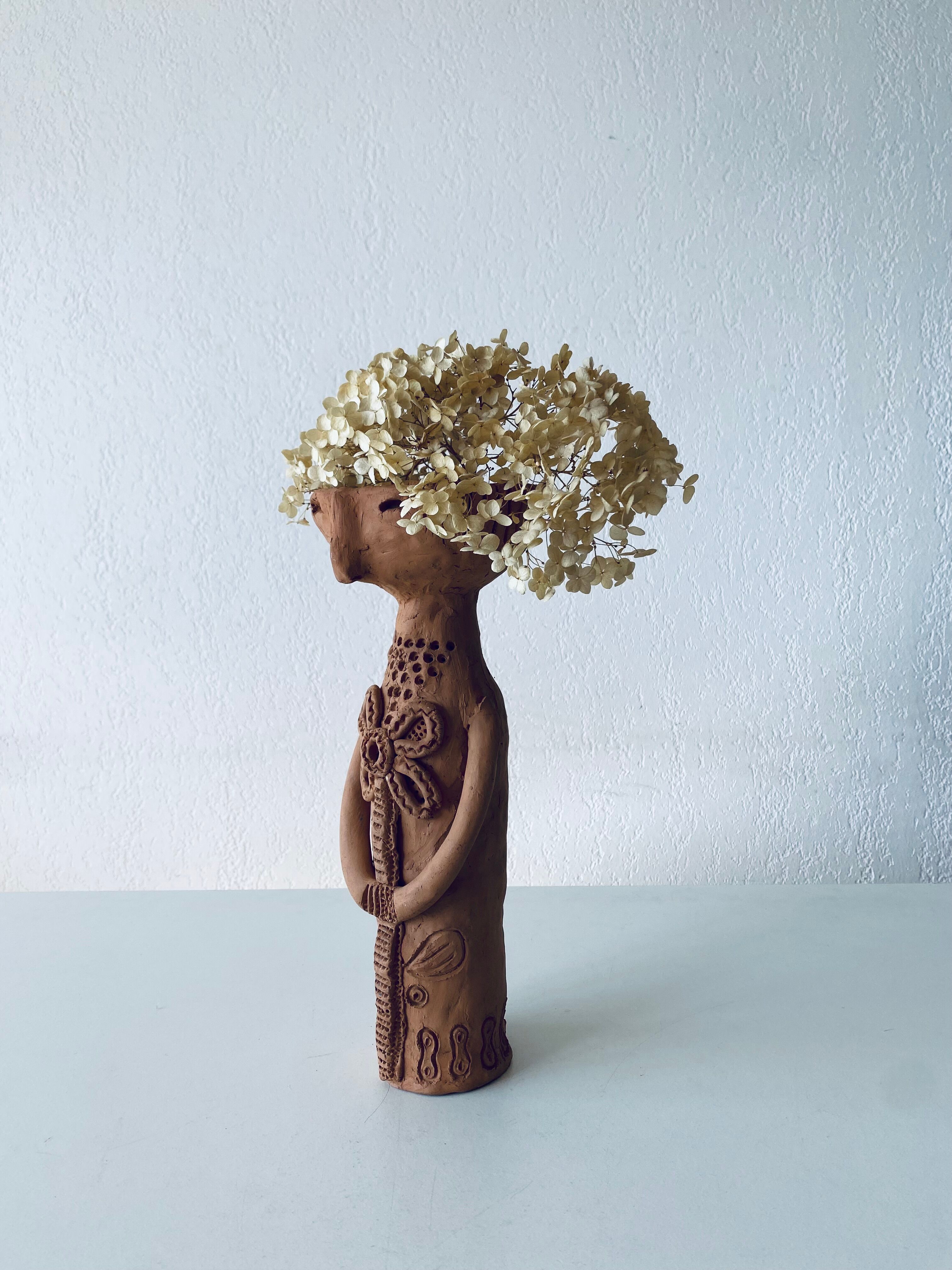 Terracotta personified vase