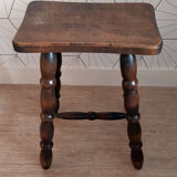 Brown turned wooden stool.