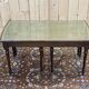 English nesting tables in mahogany and leather top under glass - work from the 1950s