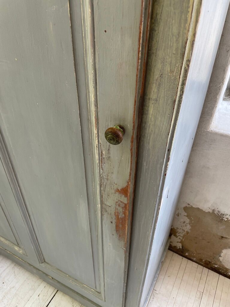 Blue patinated cap cabinet