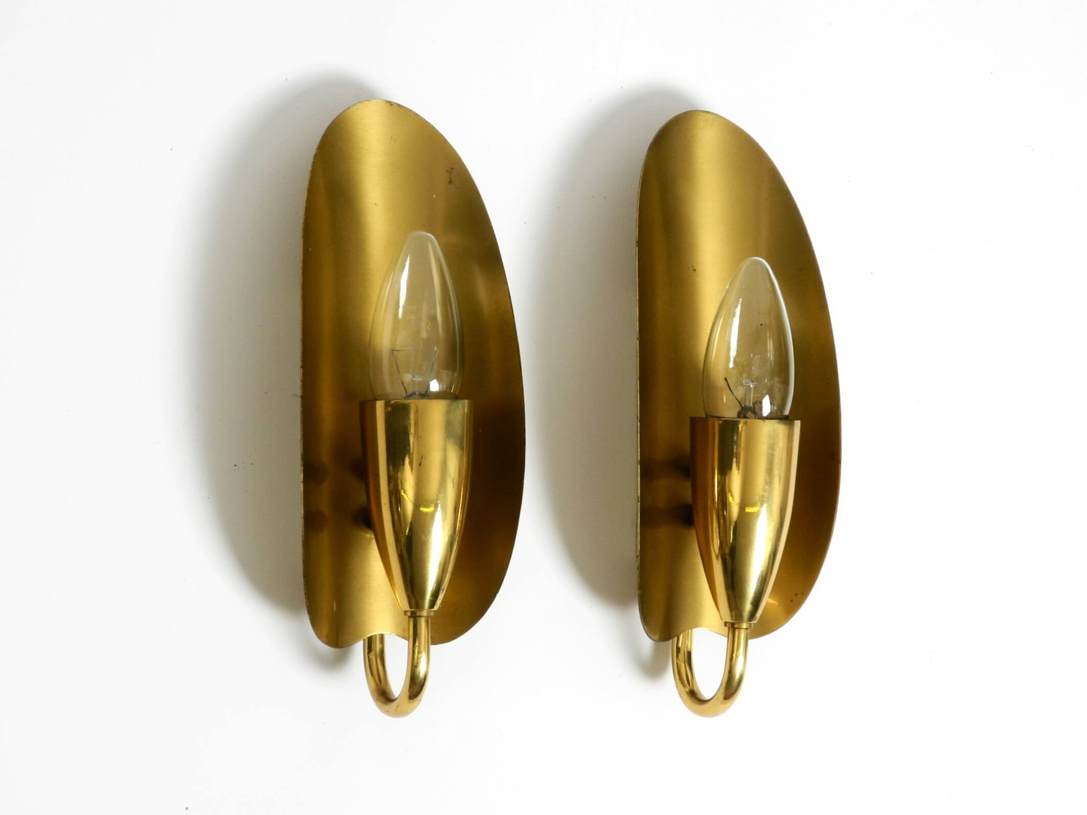 Two magical original Mid Century Modern bag brass wall lamps