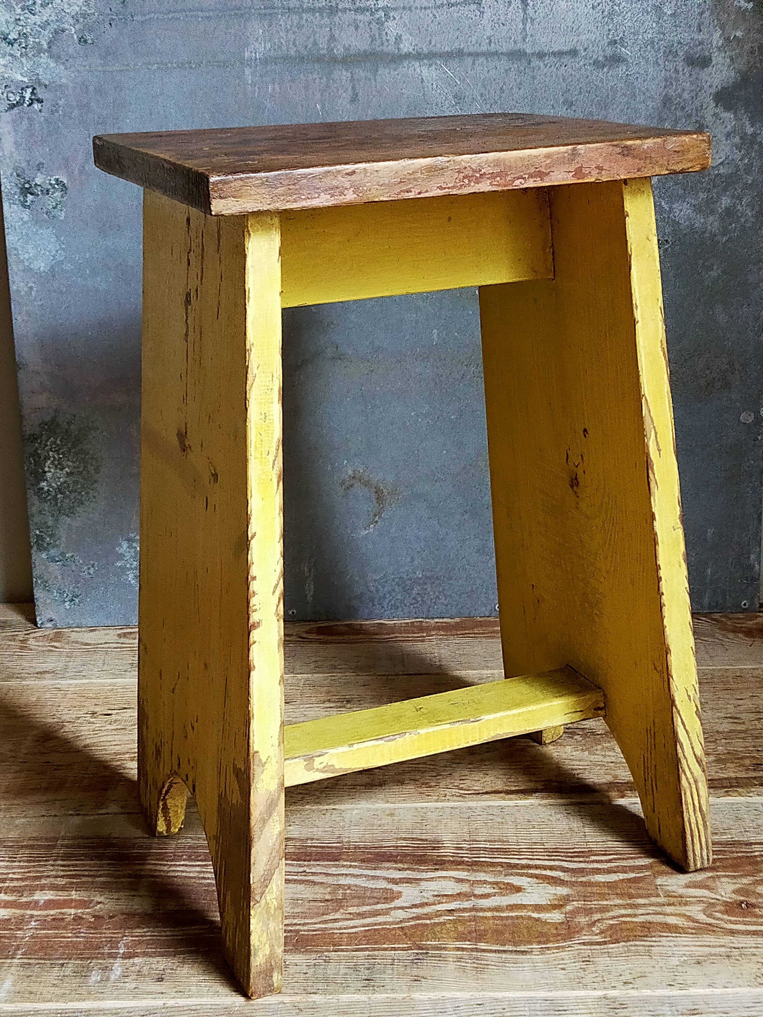 Art-populaire workshop stool in patinated wood