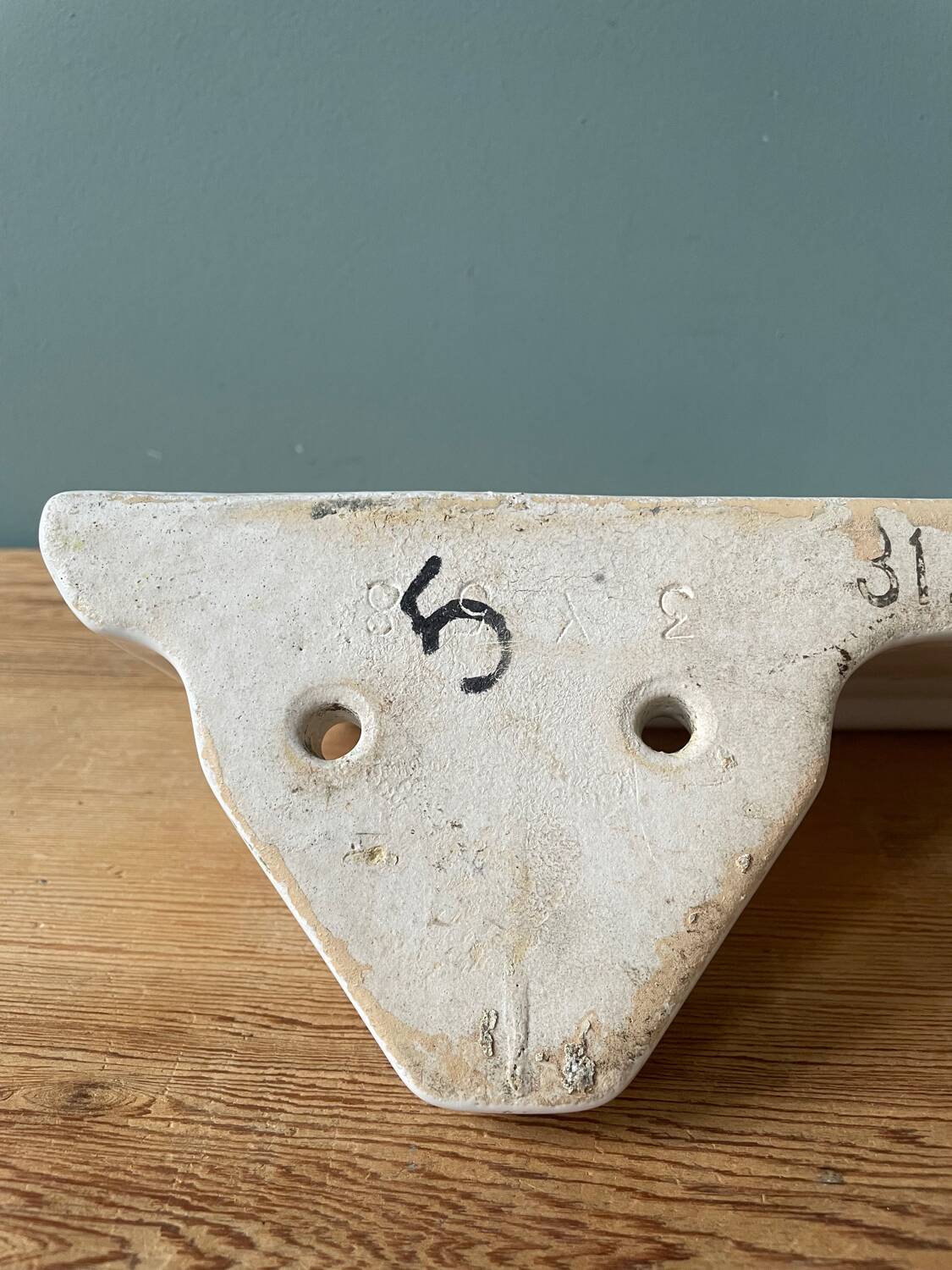 Art Deco wall shelf in white porcelain