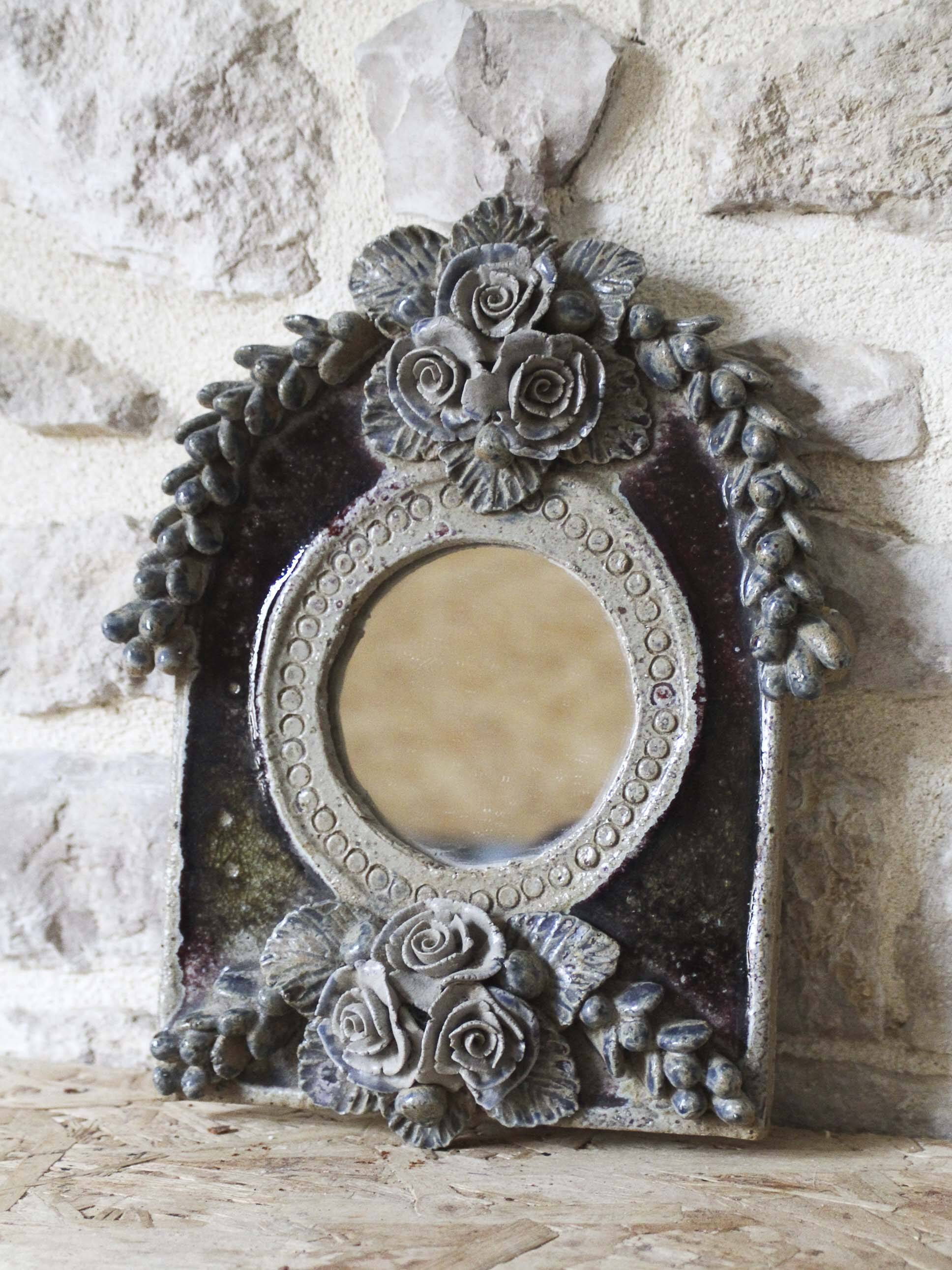 Ceramic mirror decorated with flowers