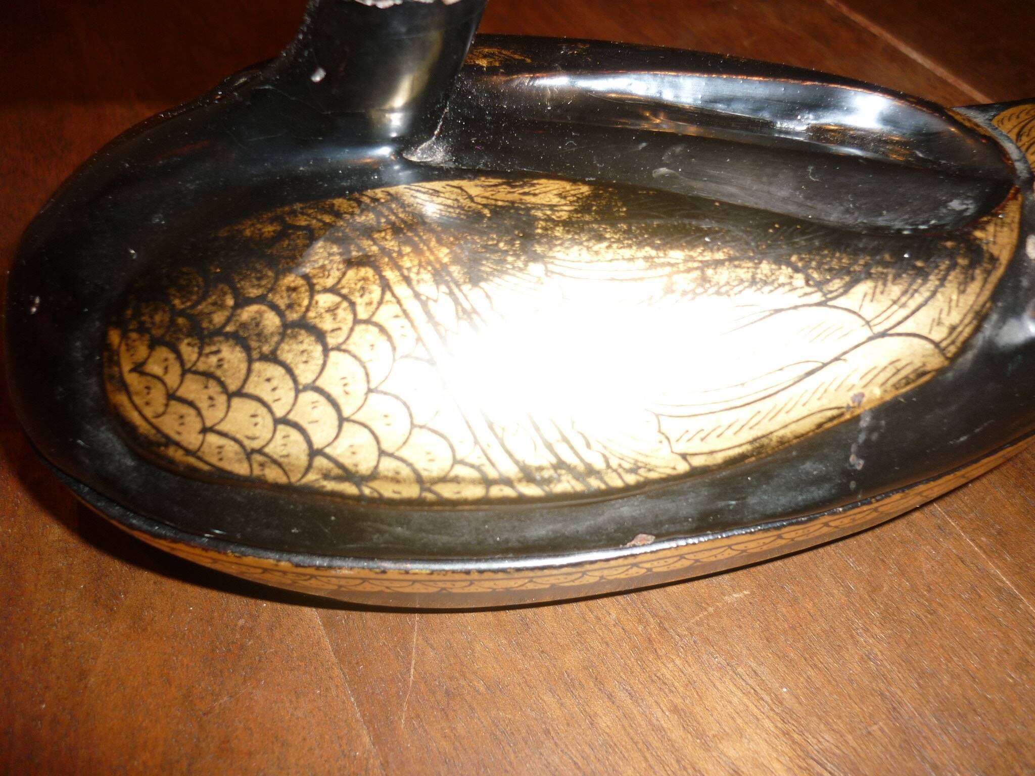 Black and gold wooden duck