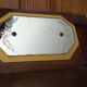 Vintage Art Deco wall coat rack in two-tone wood with engraved mirror.