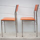 Paire de chaises métal chromé et skaï orange