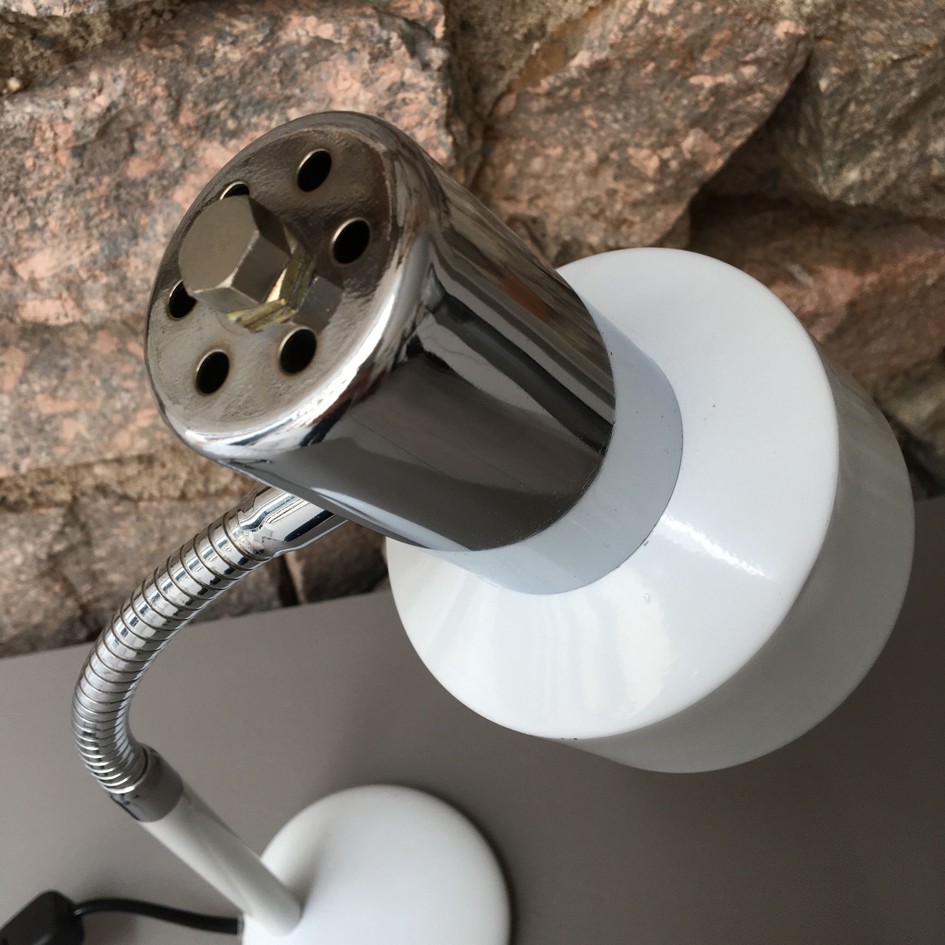 flexible white and stainless steel desk lamp