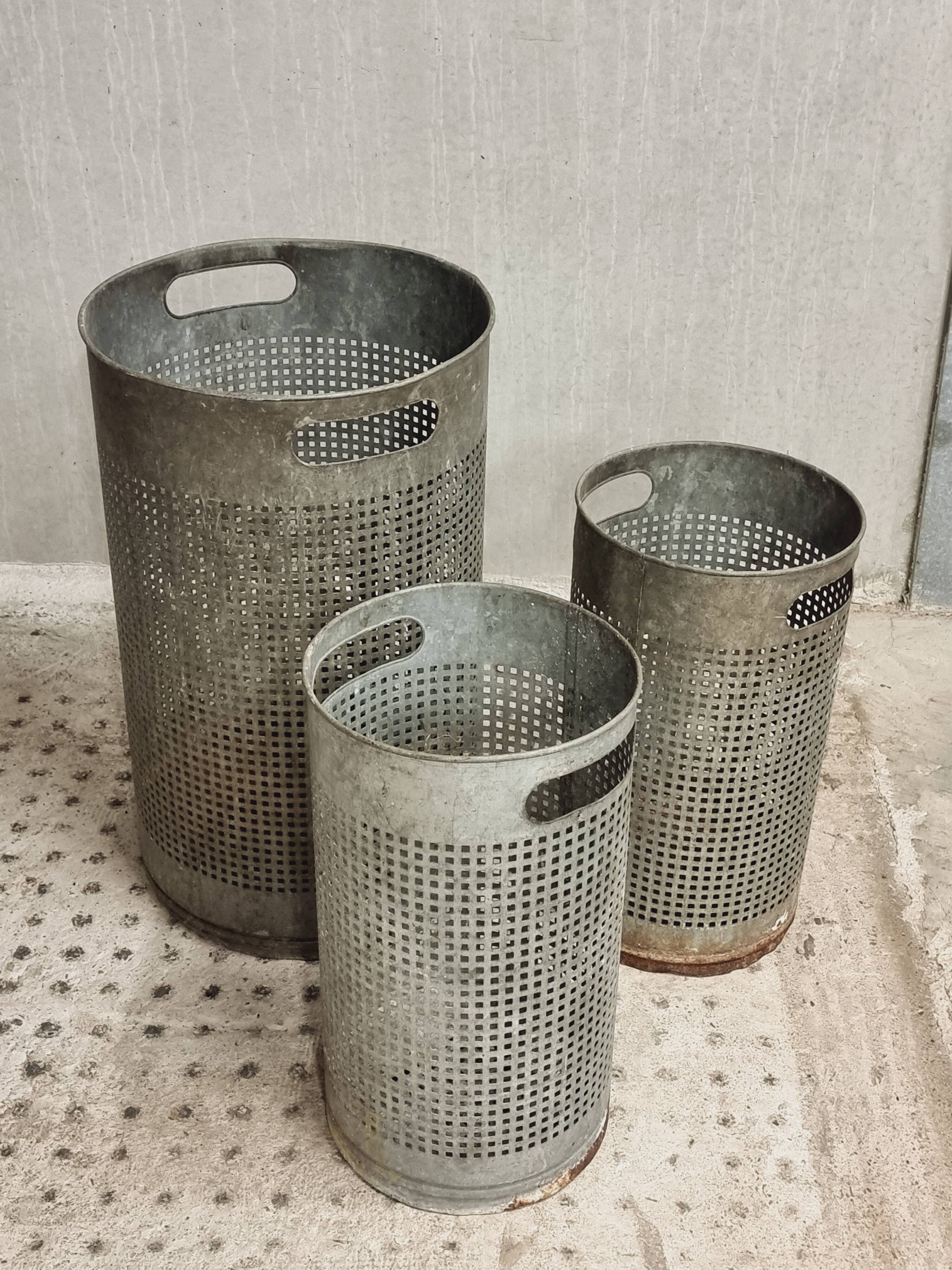 Vintage set of perforated metal waste bins