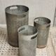 Vintage set of perforated metal waste bins