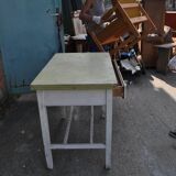 Rustic extendable dining table in white wood with an olive top, 1950s.