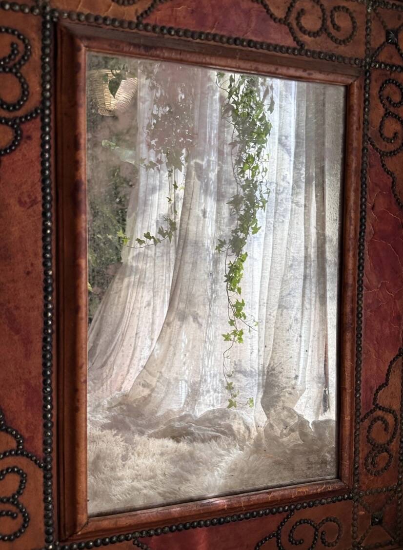 Antique mirror designed by "Pierre Lottier". Leather and nails. France 1