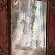 Antique mirror designed by "Pierre Lottier". Leather and nails. France 1