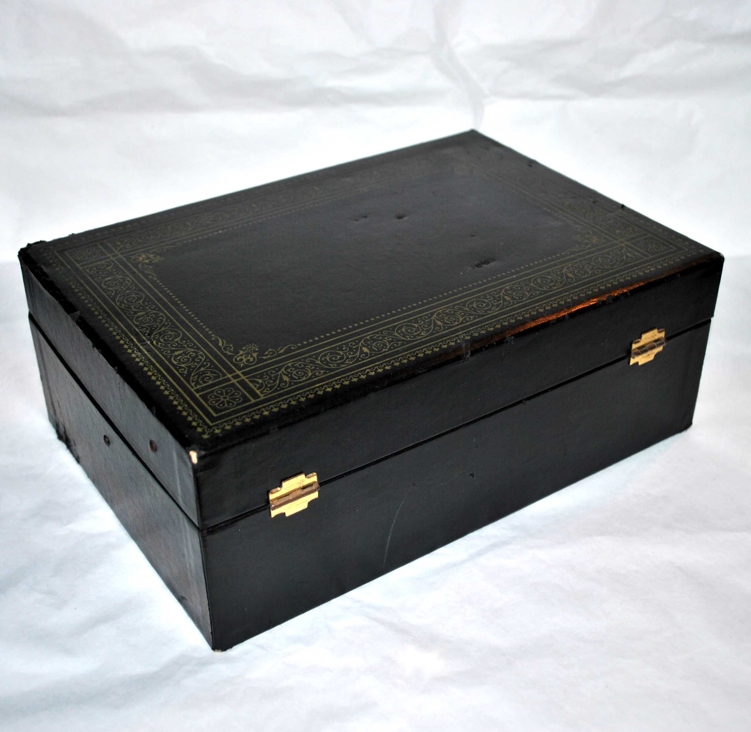 Vintage jewelry box in black leather and red interior