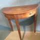 Old wooden half moon table