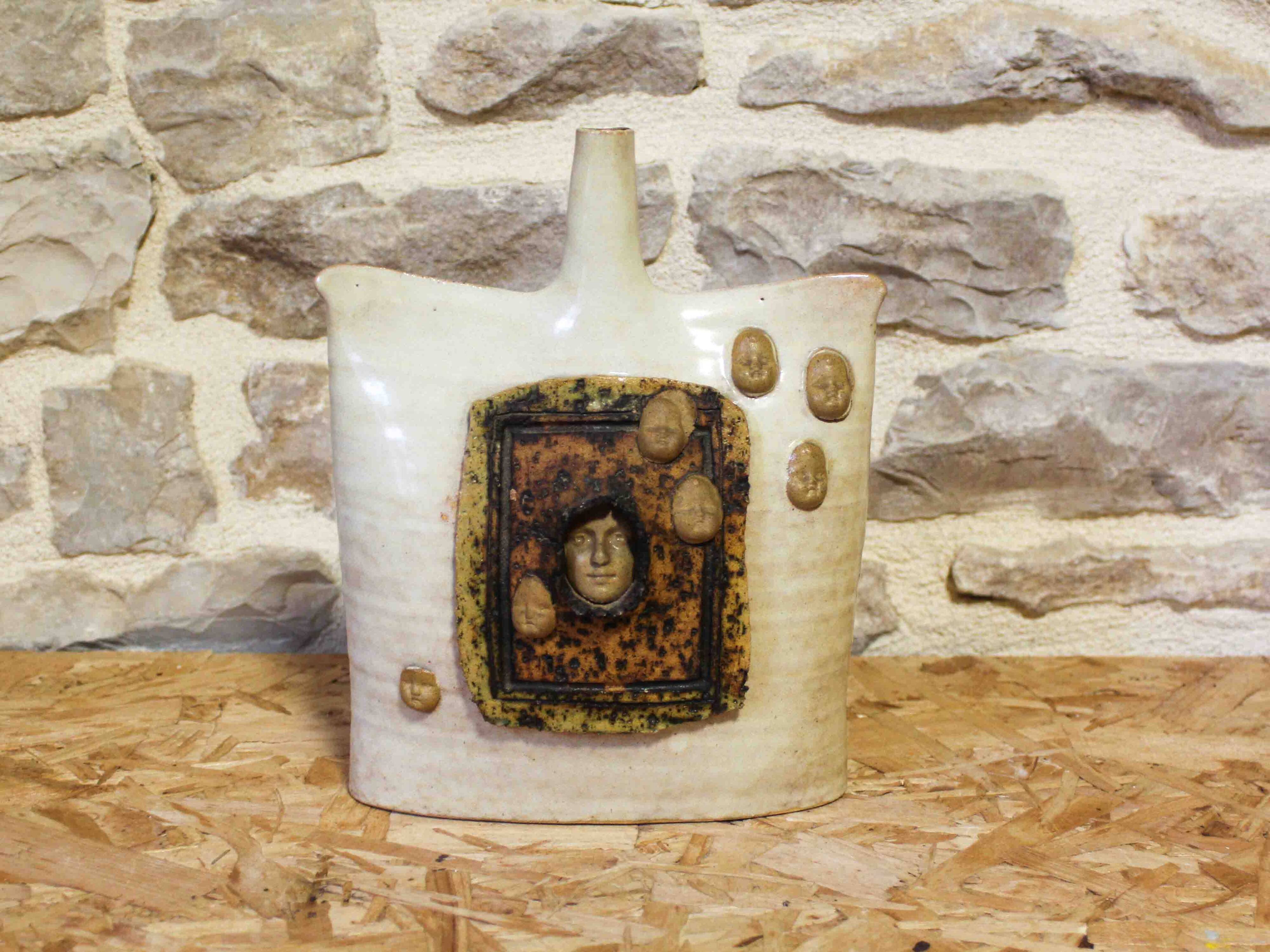 Ceramic soliflore vase with face decoration