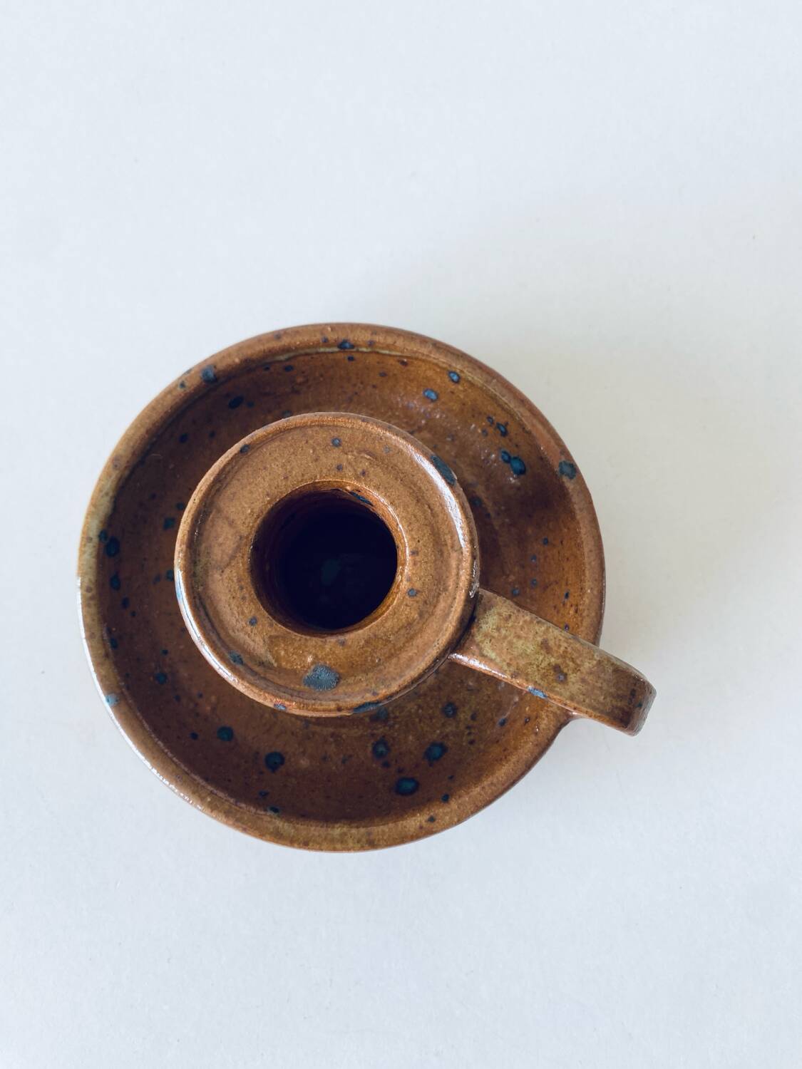 Signed sandstone candle holder