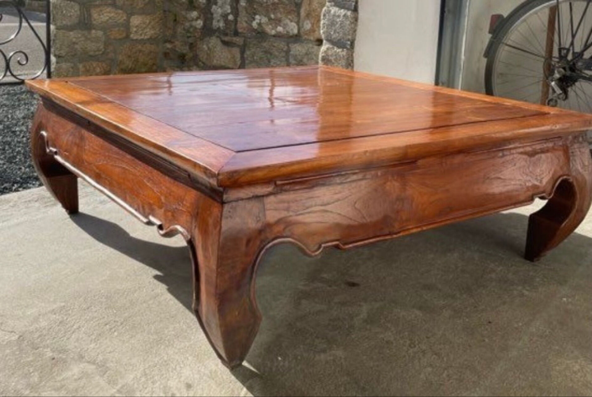 Teak coffee table in opium style.